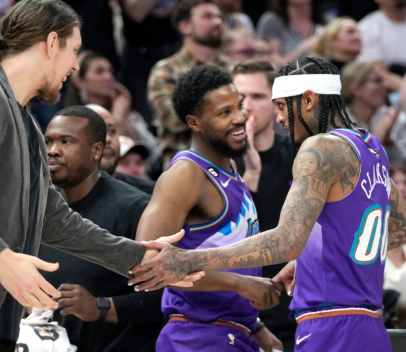 (Leah Hogsten | The Salt Lake Tribune) Utah Jazz guard Jordan Clarkson (00) is celebrated by teammates Utah Jazz guard Malik Beasley (5) and Utah Jazz forward Lauri Markkanen (23) in the second half as the Utah Jazz host the Philadephia 76ers at Vivint Arena, Jan. 13, 2023.