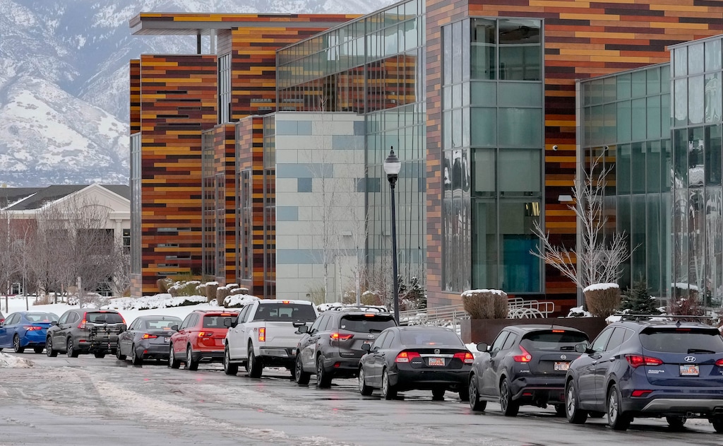 (Francisco Kjolseth | The Salt Lake Tribune) Long lines of cars snake around West Jordan City Hall and past the adjacent West Jordan Library on Tuesday, Jan. 4, 2022, as people wait for COVID-19 testing.