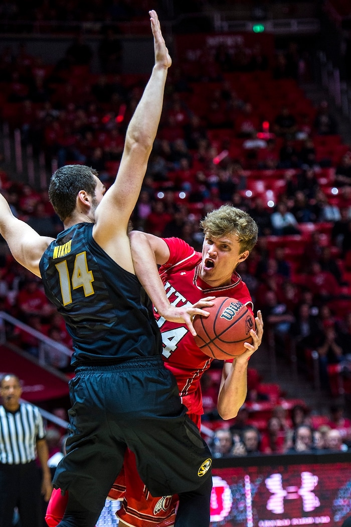 (Chris Detrick  |  The Salt Lake Tribune)  Missouri Tigers forward Reed Nikko (14) guards Utah Utes forward Jayce Johnson (34) during the game at the Jon M. Huntsman Center Thursday, November 16, 2017.   