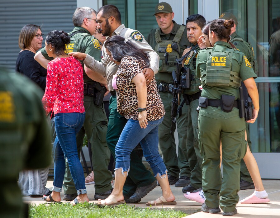 (William Luther | The San Antonio Express-News via AP) People leave the Uvalde Civic Center following a shooting earlier in the day at Robb Elementary School, Tuesday, May 24, 2022, in Uvalde, Texas.
