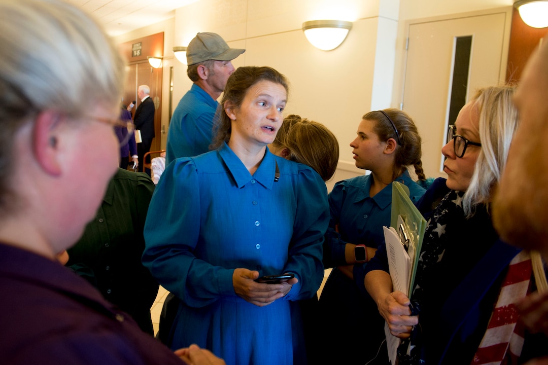 (Jeremy Harmon  |  The Salt Lake Tribune) Lori Barlow, center, talks to Christine Katas, right, after a UEP hearing in Salt Lake City on Tuesday, June 18, 2019. 