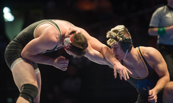 (Rick Egan  |  The Salt Lake Tribune)   Cooper Legas (Orem) wrestles Byron Anderson (DESERT HILLS) in the 195 weight class.  Legas won the match (Dec 7-5) in the 4A State Wrestling at UVU in Orem, Saturday, February 10, 2018.


