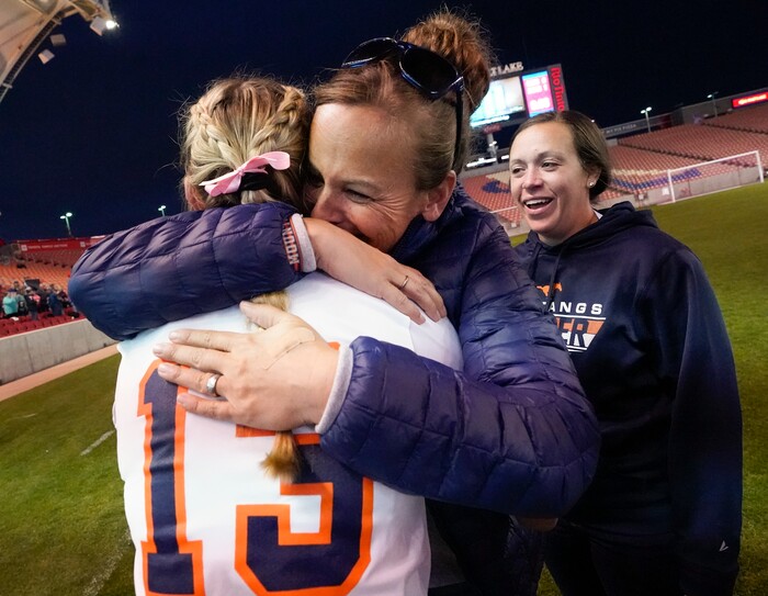 (Leah Hogsten | The Salt Lake Tribune) Mountain Crest's head coach Amber Hyatt hugs Summer Sofonia after Sofonia's free kick won the game at the 4A State Soccer Championship game between Mountain Crest High School and Crimson Cliffs High School, Oct. 22, 2021 at Rio Tinto Stadium. Mountain Crest defeated Crimson Cliffs 1-0 in double overtime.