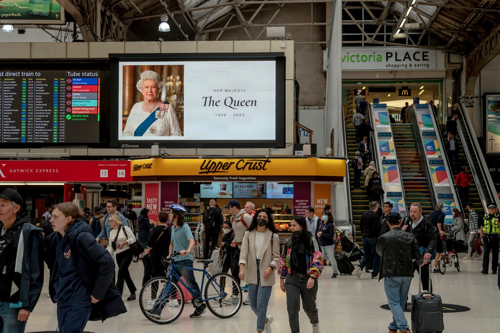 (Andrew Testa | The New York Times)

A portrait of Queen Elizabeth is displayed at Victoria Station in London on Friday, Sept. 9, 2022.