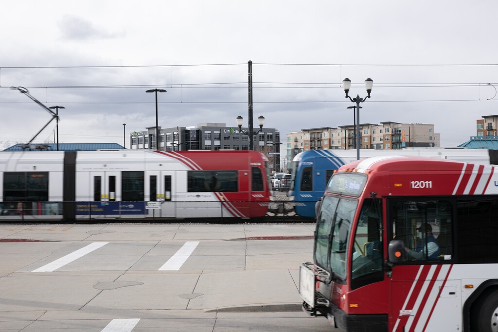 (Rachel Rydalch | The Salt Lake Tribune) TRAX trains and buses are pictured at Murray Central Station on Tuesday, Feb. 22, 2022. A child with a bicycle was struck and killed by a TRAX train in Sandy early Monday, authorities said.