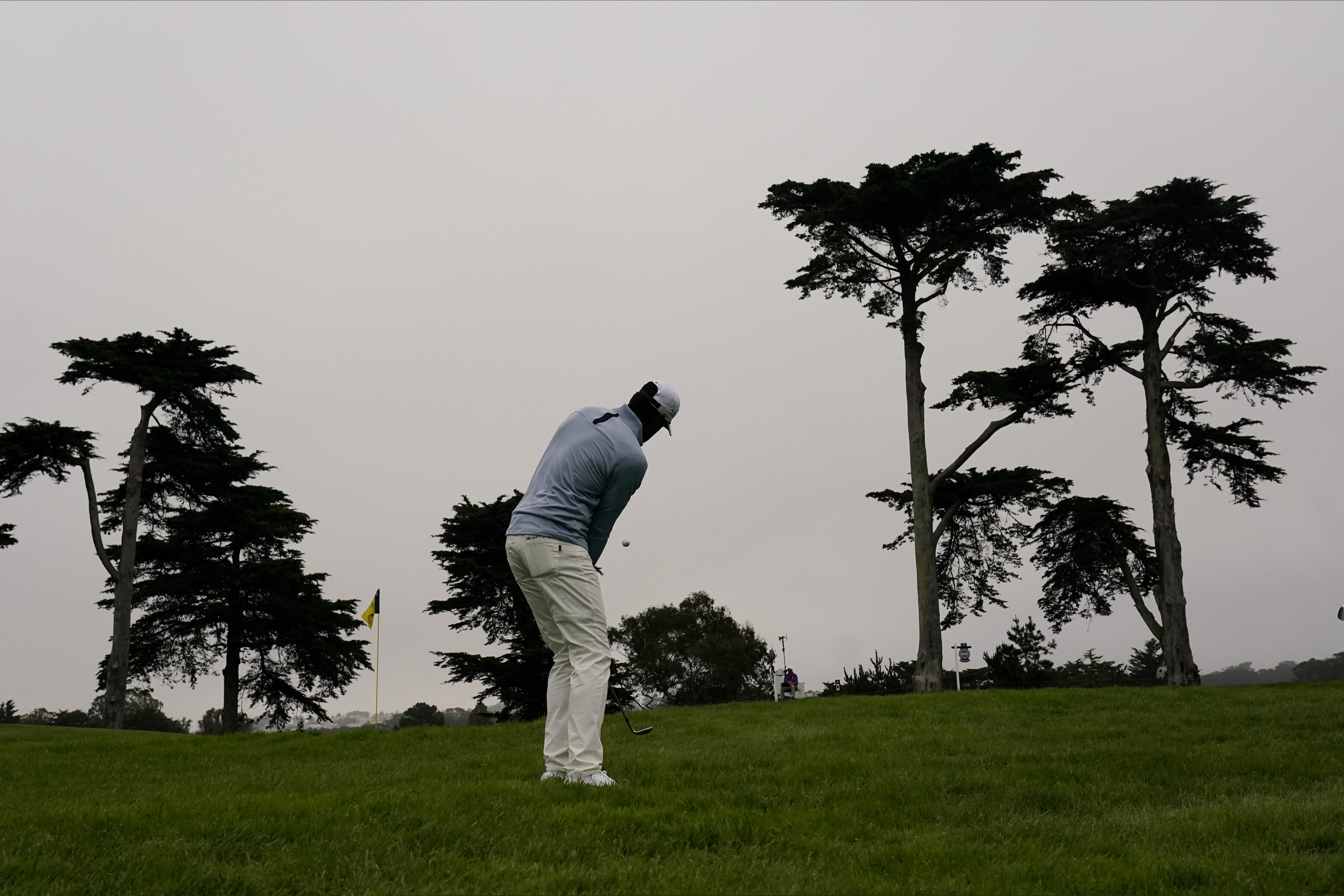 (Jeff Chiu | AP) Tony Finau chips to the green on the 10th hole during the first round of the PGA Championship golf tournament at TPC Harding Park Thursday, Aug. 6, 2020, in San Francisco.