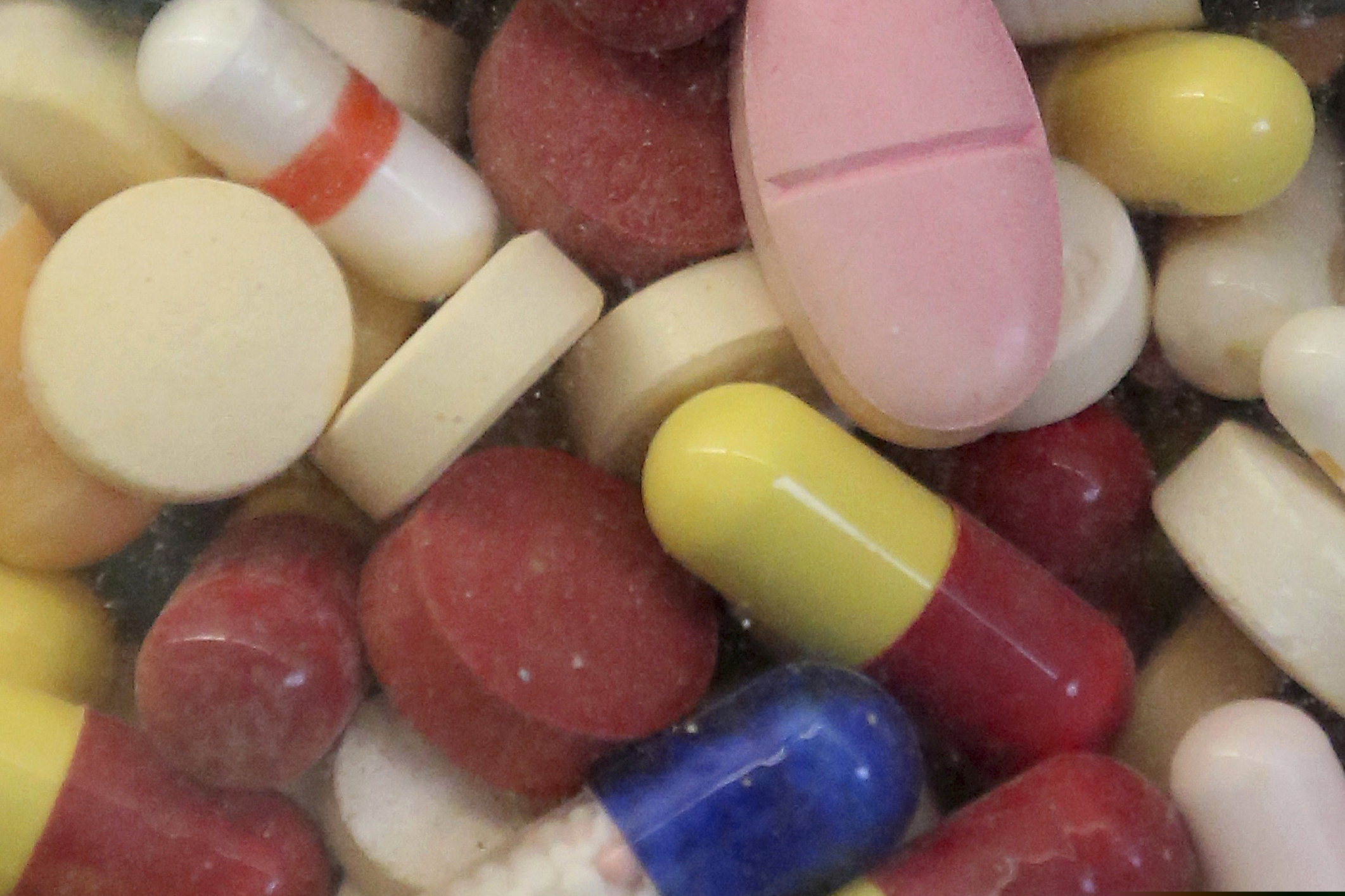 (Rick Bowmer | The Associated Press) Prescription drugs displayed in a glass flask in Taylorsville, Utah.