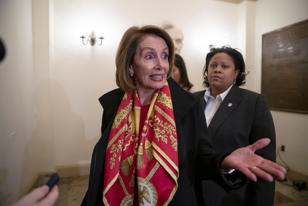 Speaker of the House Nancy Pelosi, D-Calif., responds to reporters after officially postponing President Donald Trump's State of the Union address until the government is fully reopened, at the Capitol in Washington, Wednesday, Jan. 23, 2019. The California Democrat told Trump in a letter Wednesday the Democratic-controlled House won't pass the required measure for him to give the nationally televised speech from the House floor. (AP Photo/J. Scott Applewhite)