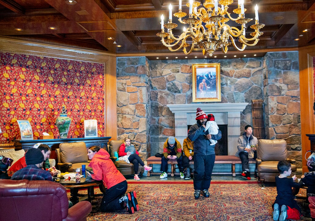(Kim Raff | The New York Times) Guests in a common area during lunch time at the Snowbasin resort in Utah, Feb. 1, 2020.