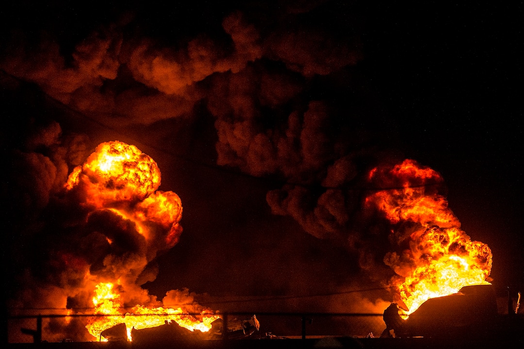(Chris Detrick  |  The Salt Lake Tribune)  A semitrailer hauling thousands of gallons of fuel burns on Interstate-15 in Midvale Thursday, January 18, 2018.   Lt. Todd Royce of the Utah Highway Patrol said the truck was southbound on the interstate at 7500 South at 7:20 p.m. when a tire caught fire, sending flames toward the tanks.