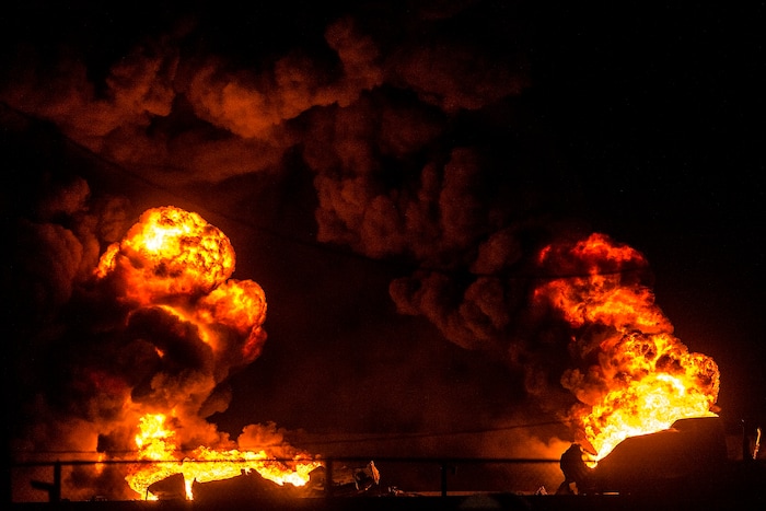 (Chris Detrick  |  The Salt Lake Tribune)  A semitrailer hauling thousands of gallons of fuel burns on Interstate-15 in Midvale Thursday, January 18, 2018.   Lt. Todd Royce of the Utah Highway Patrol said the truck was southbound on the interstate at 7500 South at 7:20 p.m. when a tire caught fire, sending flames toward the tanks.