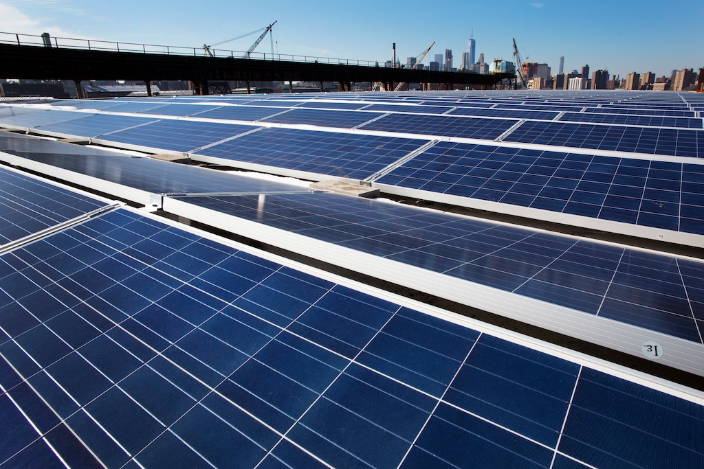 (Mark Lennihan | Associated Press) In this Feb. 14, 2017, file photo, a rooftop is covered with solar panels at the Brooklyn Navy Yard in New York. In January 2018, the U.S. government moved to tax imported solar cells and washing machines. Two U.S. senators from Western states joined the legislative fight Thursday to repeal President Donald Trump's tariffs on imported solar panels, saying the higher taxes on foreign producers are jeopardizing jobs in the U.S.