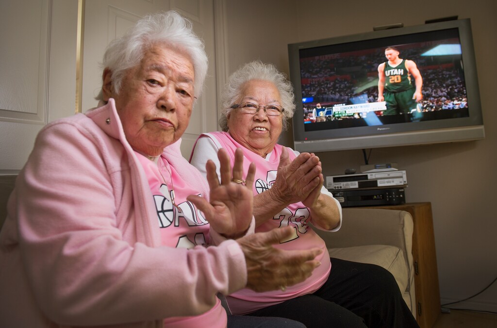 Leah Hogsten  |  The Salt Lake Tribune The "Pink Grandmas", Yeiko Hommas and Keiko Mori sit in Keiko's family room on Sunday, April 30, 2017 as game 7 of the playoff series between the Utah Jazz and the Los Angeles Clippers broadcasts. Utah Jazz forward Gordon Hayward (20), a favorite player of theirs whose play always elicits applause from the two. 