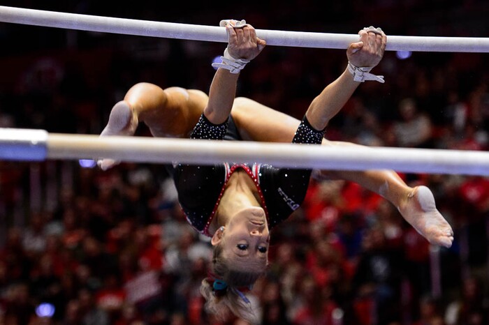 (Trent Nelson | The Salt Lake Tribune)  MaKenna Merrell-Giles on bars as Utah hosts Washington, NCAA gymnastics in Salt Lake City, Saturday February 3, 2018.