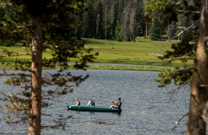 (Leah Hogsten  |  The Salt Lake Tribune)  Fly fishing enthusiasts fish from a canoe on Lilly Lake, Aug. 6, 2017.