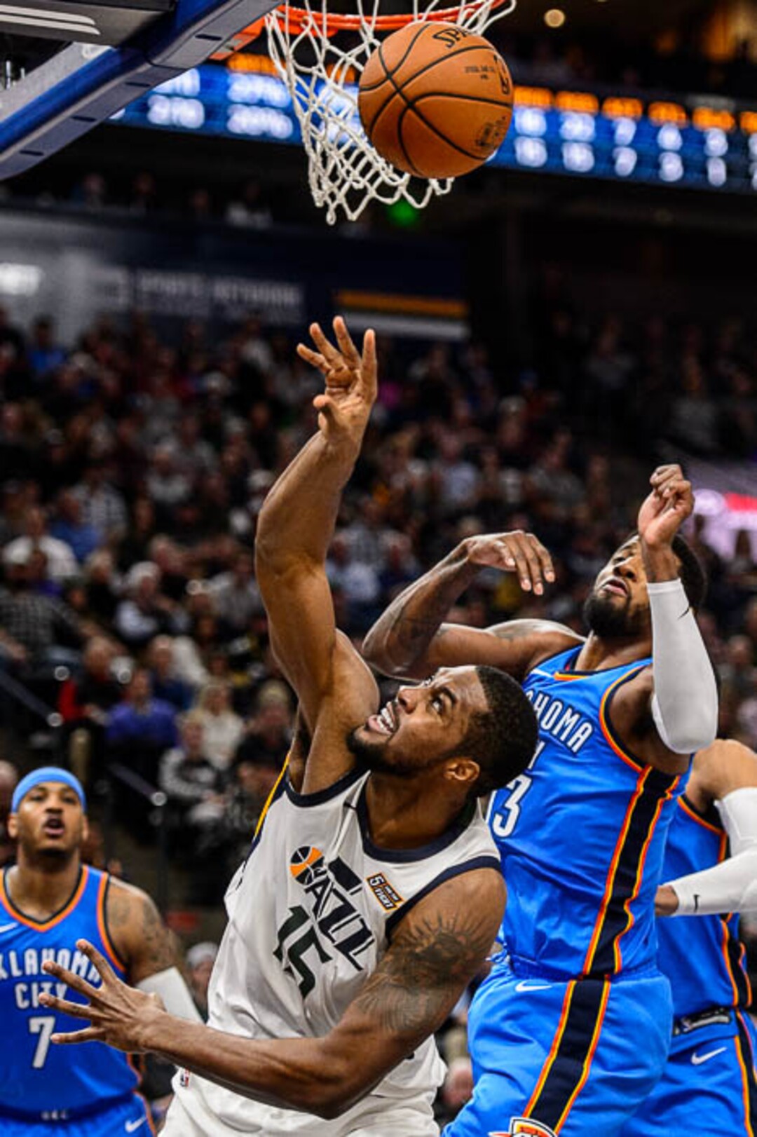 (Trent Nelson | The Salt Lake Tribune)  Oklahoma City Thunder forward Paul George (13) blocks a shot by Utah Jazz forward Derrick Favors (15) as the Utah Jazz host the Oklahoma City Thunder, NBA basketball in Salt Lake City, Saturday December 23, 2017.