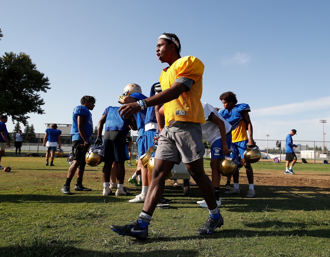 (Gary Kazanjian | Special to The Tribune) Clovis High School quarterback Nate Johnson works out with his team at Clovis High School, who committed to play for the University of Utah, shown Wednesday, July 28, 2021, in Clovis, Calif.