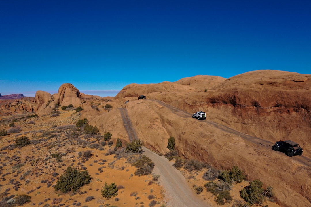 (Leah Hogsten | The Salt Lake Tribune) An off-road utility terrain vehicle (UTV) eases up Hell's Revenge 4x4 Trail at the Sand Flats Recreation Area trail, located just 4 miles from downtown Moab, Feb. 19, 2021.