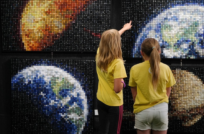 (Francisco Kjolseth  |  The Salt Lake Tribune)  Kids admire the detail in Erik Jensen's works made up entirely of recycled keyboard keys during the annual 2019 Utah Arts Festival as it kicks off at Library Square and Washington Square in downtown Salt Lake City, Thursday, June 20, 2019, with visual and performance art of all varieties and food for all ages from June 20-23.