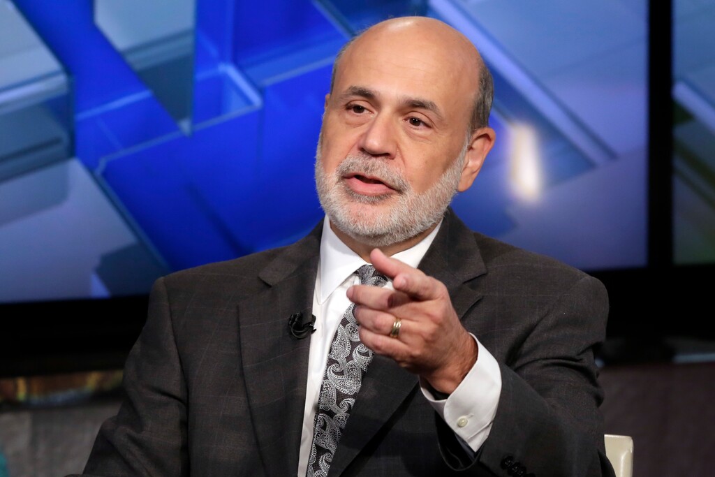 FILE - In this Oct. 6, 2015 file photo, former Federal Reserve Chairman Ben Bernanke is interviewed by Maria Bartiromo during her "Mornings with Maria Bartiromo" program, on the Fox Business Network, in New York.  Transcripts released Friday, Jan. 5, 2018,  show sharp divisions inside the Federal Reserve in 2012 over the need for a third round of bond purchases to boost a lagging economy.
The doubters expressed fears that the risks outweighed what they believed would be small benefits.  Bernanke, who was pushing for the move, conceded that whatever action the Fed took was “going to be a shot in the proverbial dark.”(AP Photo/Richard Drew, File)