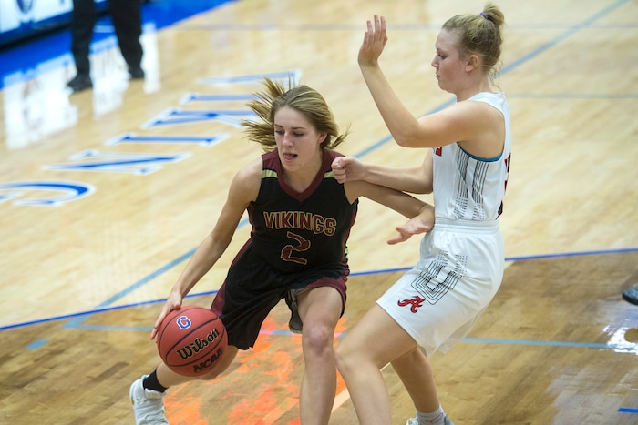 (Chris Detrick | The Salt Lake Tribune) Viewmont's Emma Carr (2) runs past Alta's Ally Braithwaite (12) during the game at Pleasant Grove High School Thursday, November 30, 2017. Viewmont defeated Alta 65-44.