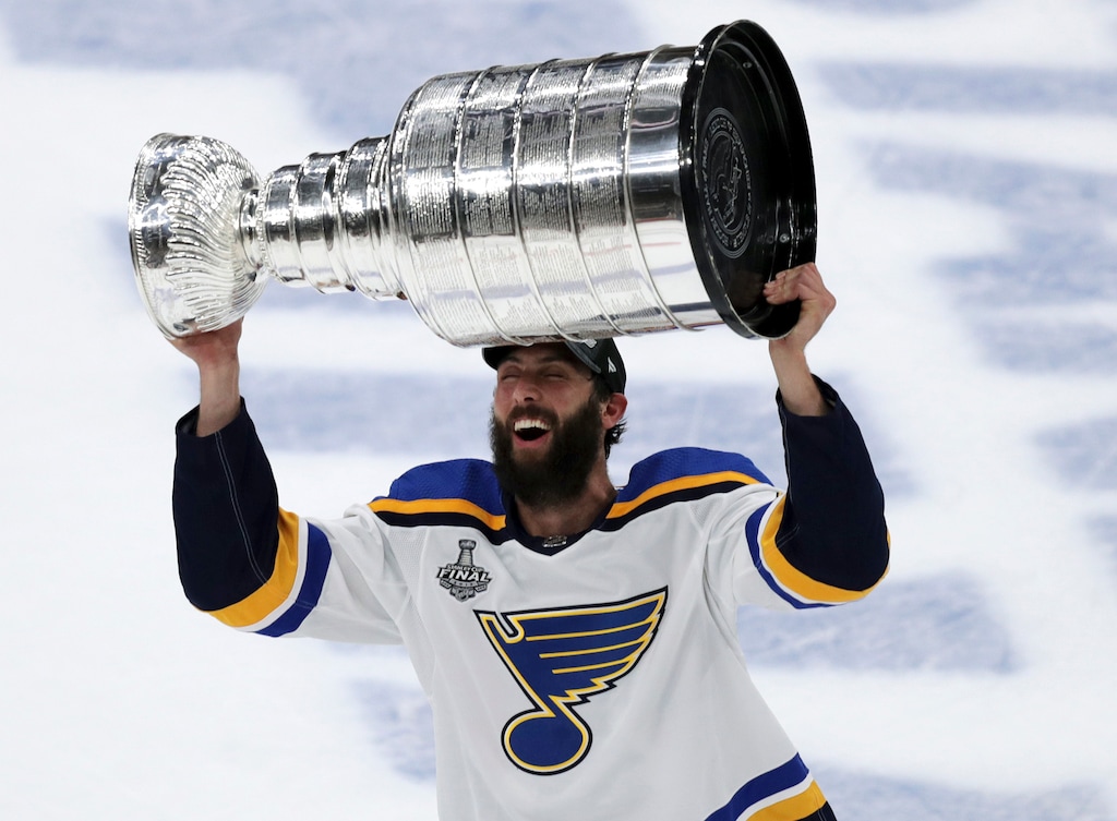(Charles Krupa | AP) Then with the St. Louis Blues, Robert Bortuzzo carries the Stanley Cup after the Blues defeated the Boston Bruins in Game 7 of the NHL Stanley Cup Fina on June 12, 2019, in Boston. Bortuzzo is brining his veteran leadership and championship experience to the new Utah Hockey Club this season.