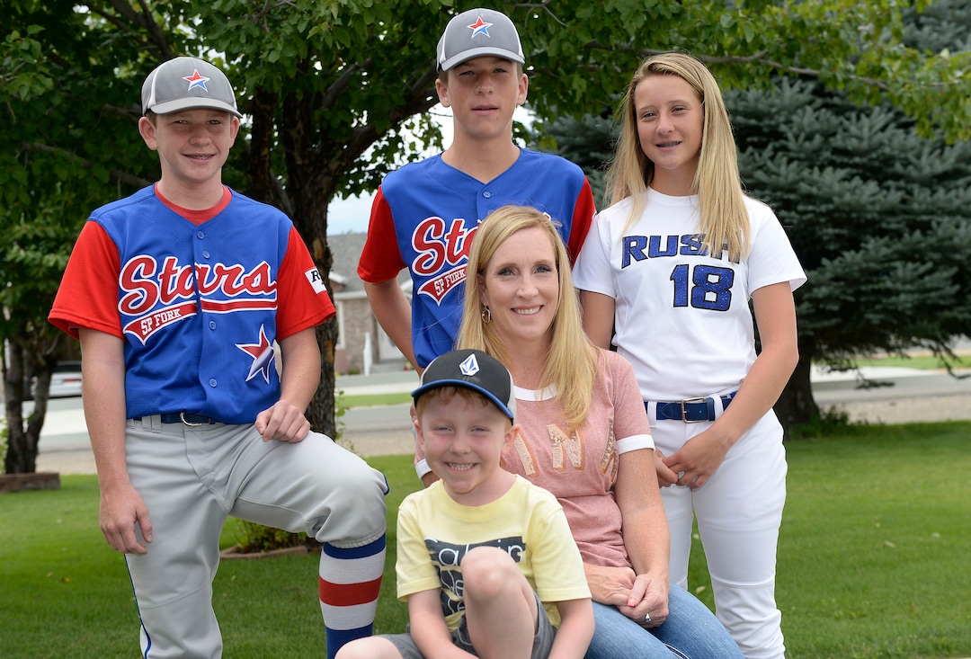 (Al Hartmann  |  The Salt Lake Tribune)  Ten years after their father, Brandon Kimber, died in the Crandall Canyon mine, twins Peyton and Paxton Kimber share a love of sports with their sister, Bryton Kimber.  Their mother, Kristin Cox, center, has married Bob Cox, not pictured. The couple has added a younger brother, Treyton Cox, to the family.