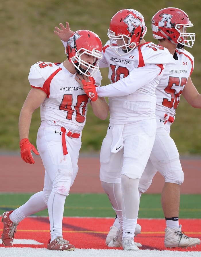 (Leah Hogsten  |  The Salt Lake Tribune) American Fork's Josh Wernli celebrates his touchdown with teammates. American Fork High School boys' football team East High School during their class 6A state quarterfinal football game, Friday, November 3, 2017