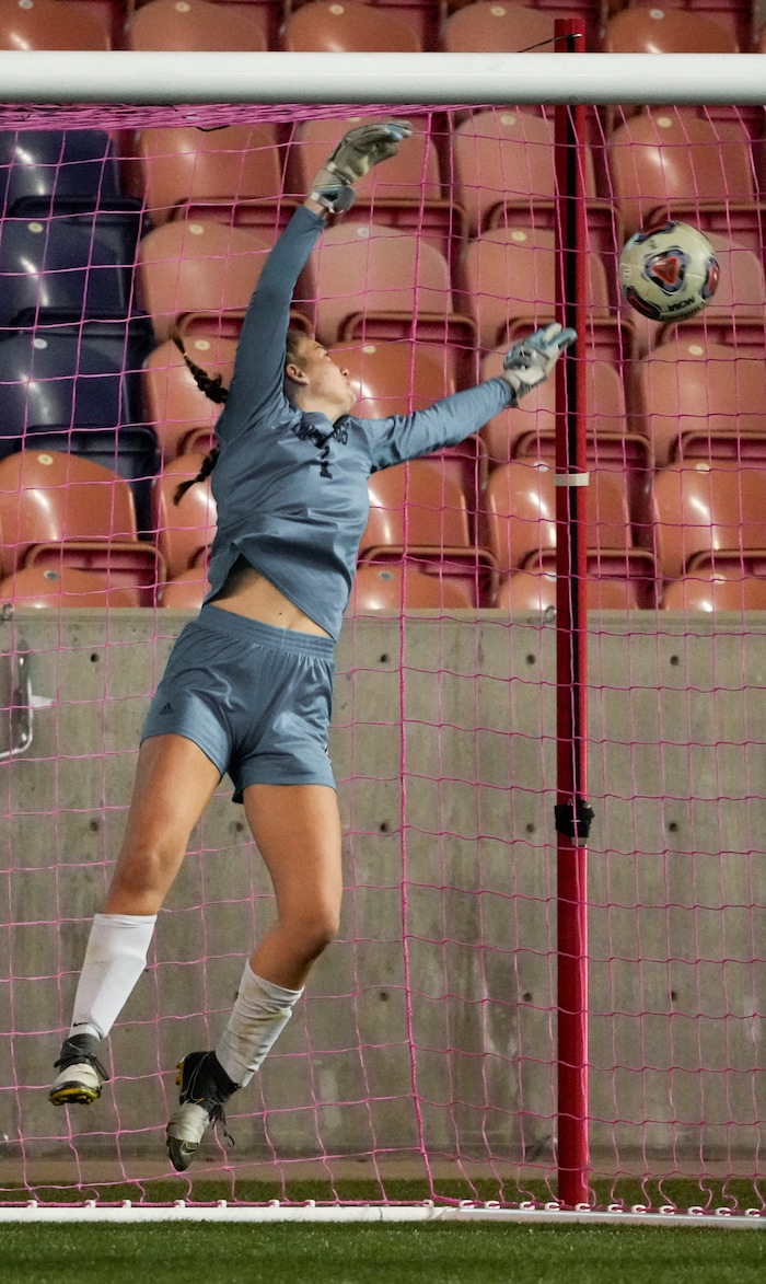(Leah Hogsten | The Salt Lake Tribune) Crimson Cliffs' goalie Ellie Nielsen just misses Mountain Crest's Summer Sofonia's free kick during the 4A State Soccer Championship game between Mountain Crest High School and Crimson Cliffs High School, Oct. 22, 2021 at Rio Tinto Stadium. Mountain Crest defeated Crimson Cliffs 1-0 in double overtime.