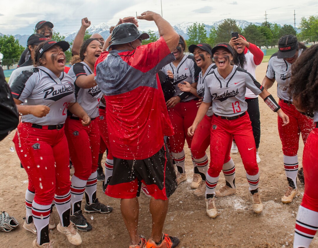 (Rick Egan  |  The Salt Lake Tribune)     West High head coach Keith Lopati reacts after getting drenched with water as the Panthers celebrates their 5A State Championship win over the Bountiful Braves, in Taylorsville, Thursday May 30, 2019