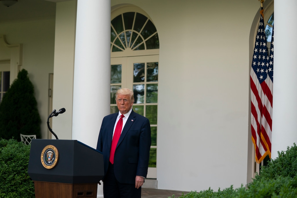 President Donald Trump listens as Vice President Mike Pence speaks during an event on protecting seniors with diabetes in the Rose Garden White House, Tuesday, May 26, 2020, in Washington. (AP Photo/Evan Vucci)