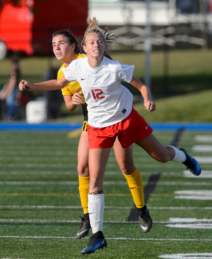 (Steve Griffin | The Salt Lake Tribune) East's Savannah Dean heads the ball upfield during the 5A semifinal girl's soccer match against Maple Mountain at Juan Diego High School in Draper Tuesday October 17, 2017.