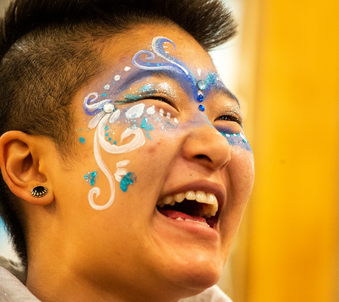 (Rick Egan  |  The Salt Lake Tribune)       A festivalgoer reacts as she sees her face, after it was painted by Artist, Consu Nikolazza, at the second annual Made in Utah Winter Fest at The Gateway.  The free festival includes local artists, musicians, artisans, breweries, distilleries, food trucks, and other local businesses, to help promote shopping locally for holidays. The Utah Winter Fest continues December 21 & 22. Sunday, Dec. 15, 2019.