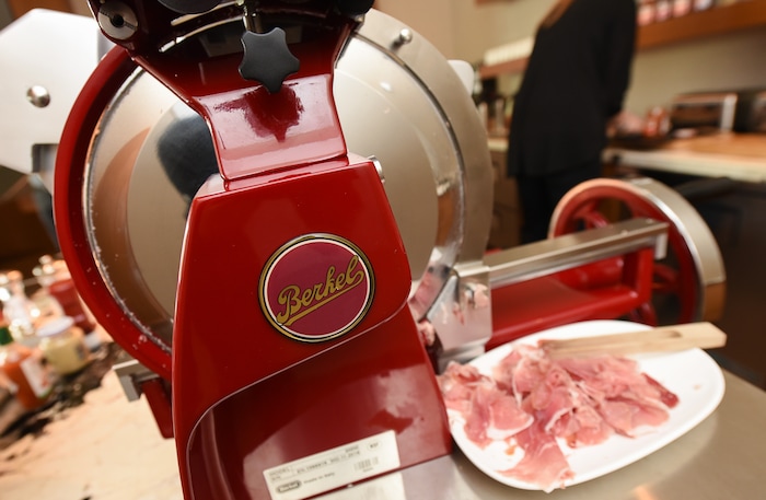 (Francisco Kjolseth  |  The Salt Lake Tribune)  The new AC Hotel in Salt Lake City has a $10,000 Berkel prosciutto slicer. Fire Engine red with chrome trim and a fly wheel that turns manually, it cuts the prosciutto paper thin for the hotel's daily continental breakfast.