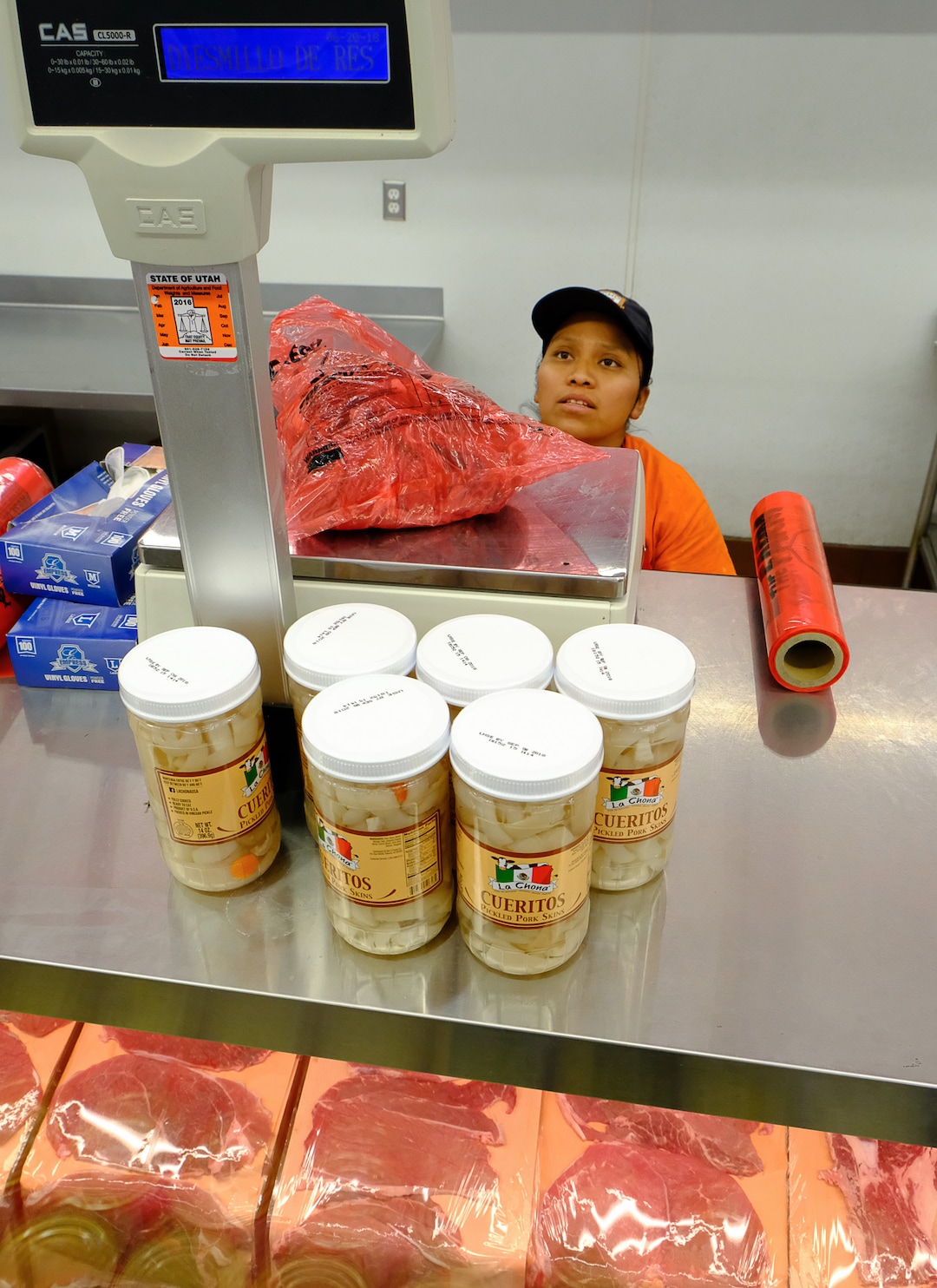 (Francisco Kjolseth  |  The Salt Lake Tribune) Rosario Domingo prepares an order in the meat department on Wed. June 20, 2018, at Rancho Market at North Temple and 900 West, a chain that started in 2006 and now has 10 stores. The owner says half of their shoppers are Latino, and it caters to other immigrant groups and long-time residents. New Census numbers show a continuing growth of minorities in Utah. Minorities have grown by 132k since the 2010 Census in Utah, and the Latino population has grown by 76k since then.