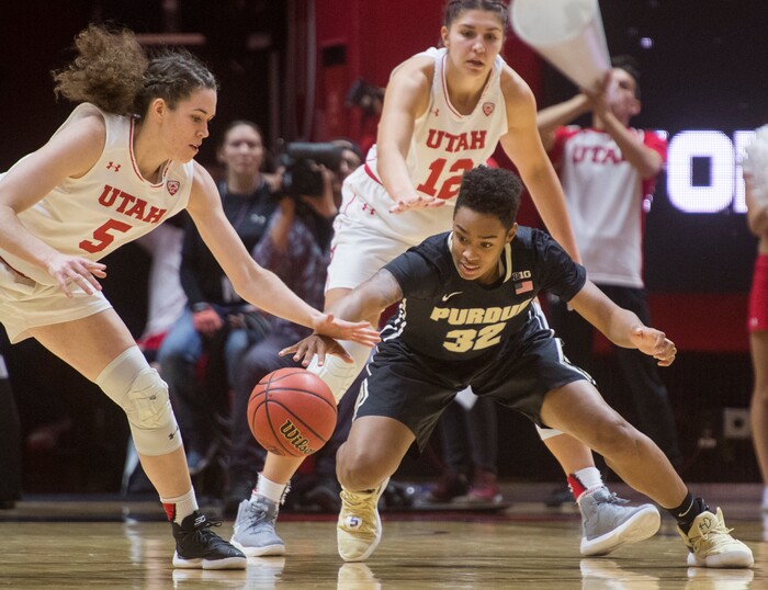 (Rick Egan  |  The Salt Lake Tribune)  Utah Utes center Megan Huff (5) steals the ball from Purdue Boilermakers forward Ae'Rianna Harris (32), in basketball action Utah Utes vs. Purdue Boilermakers, at the Jon M. Huntsman Center, Monday, November 20, 2017.