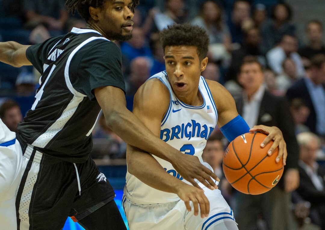 (Rick Egan  |  The Salt Lake Tribune)        Brigham Young Cougars guard Blaze Nield (3) dribbles past Nevada Wolf Pack guard Lindsey Drew (14), in basketball action between the Brigham Young Cougars and the Nevada Wolf Pack, at the Marriott Center, in Provo, Saturday, December 10, 2019.