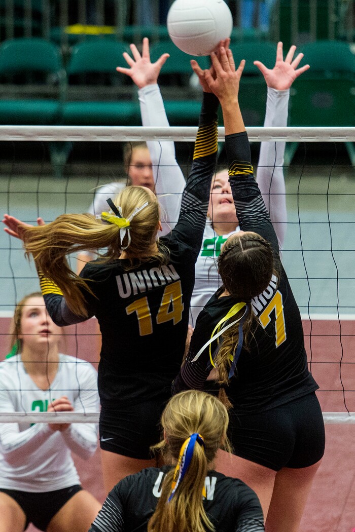 (Chris Detrick  |  The Salt Lake Tribune)  Union's Reagan Anderson (14) and Union's Marleigh Harrocks (7) block South Summit's Miranda Miles (26) during the 3A volleyball state quarterfinals at the UCCU Center at Utah Valley University Wednesday, October 25, 2017.  