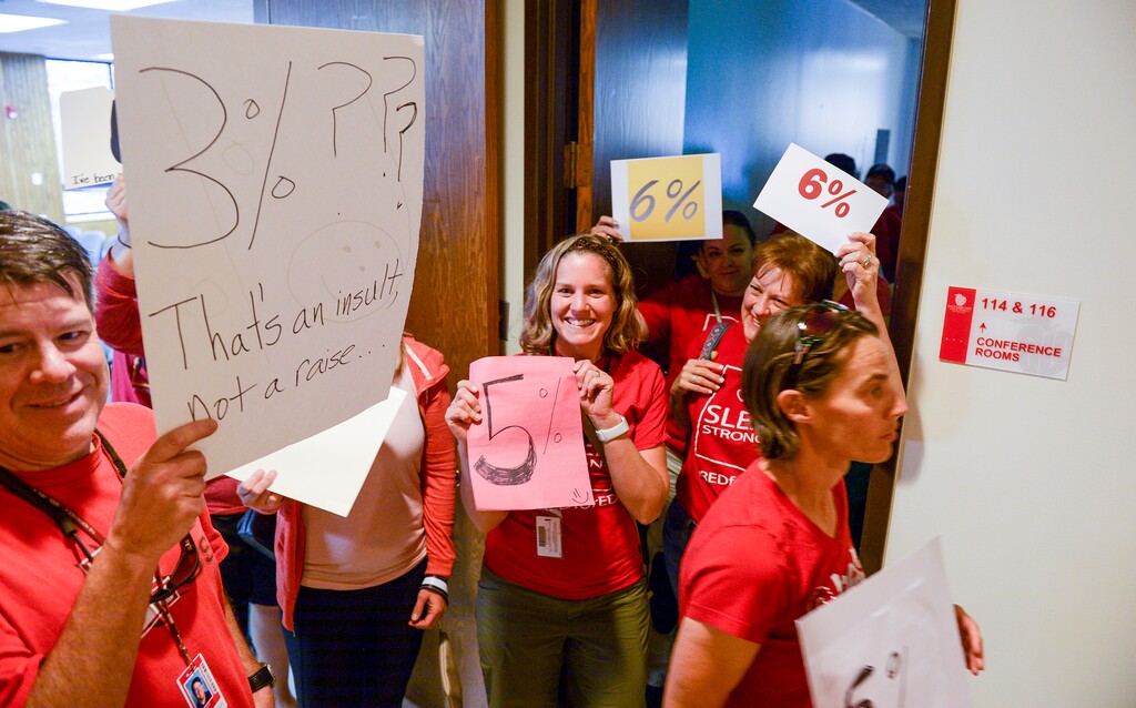 (Leah Hogsten | The Salt Lake Tribune) Teachers walk out of the public comment period at the Salt Lake City School District meeting regarding salary negotiations on June 4, 2019. More teachers are leaving Utah classrooms and one of the biggest reasons they cite is low pay. The state now has a shortage of 1,600 educators with the imbalance expected to get worse.