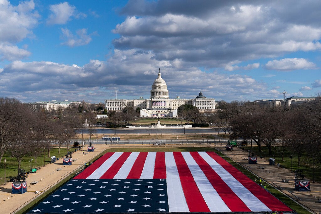 A large American Flag is are placed on the National Mall, with the U.S. Capitol behind, ahead of the inauguration of President-elect Joe Biden and Vice President-elect Kamala Harris, Monday, Jan. 18, 2021, in Washington. (AP Photo/Alex Brandon)