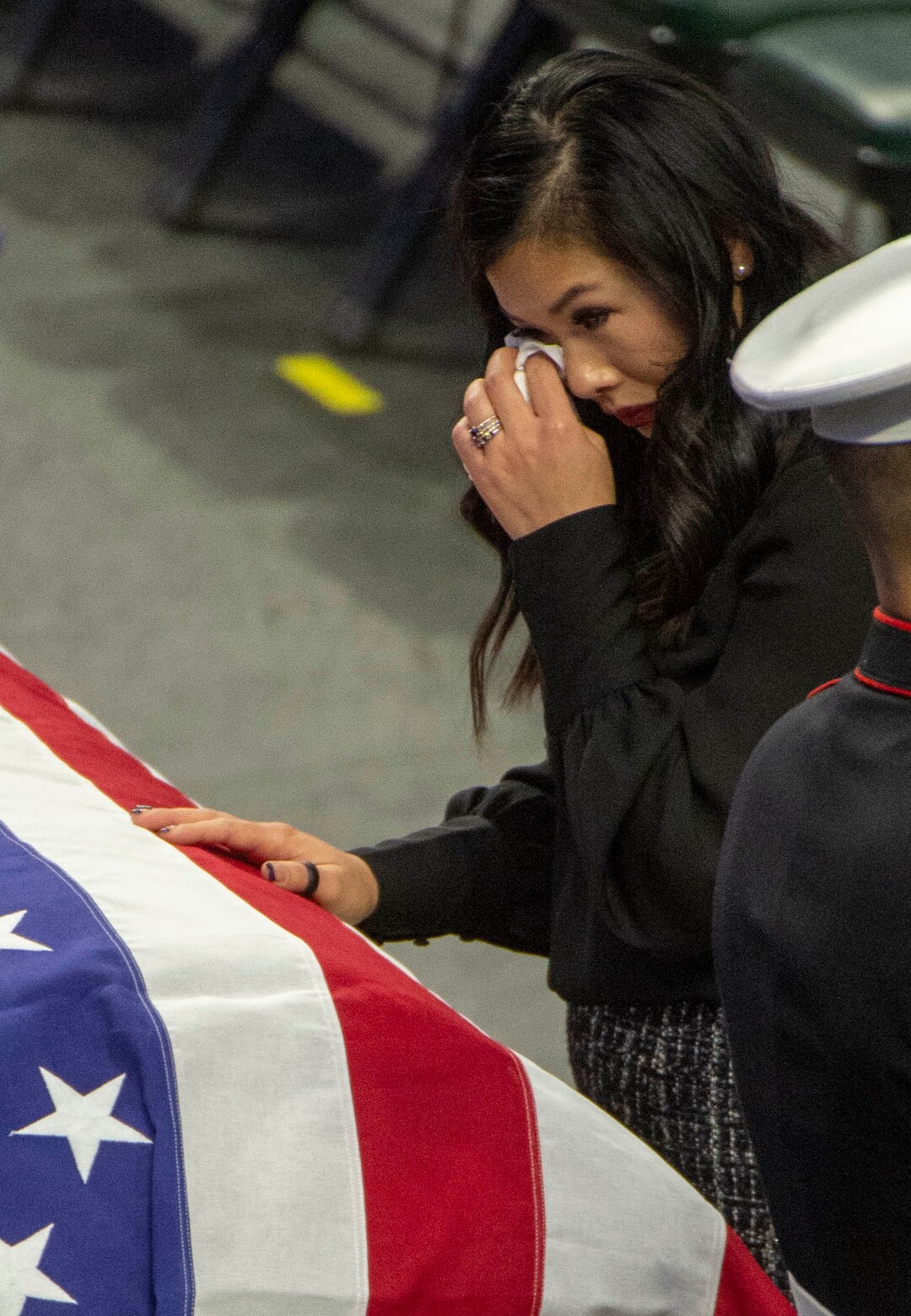 (Rick Egan  |  The Salt Lake Tribune)     Elizabeth Romrell spends a moment  by the casket of her husband, South Salt Lake police officer, David Romrell, before his funeral at the Maverik Center, in West Valley City, Wednesday, Dec. 5, 2018.