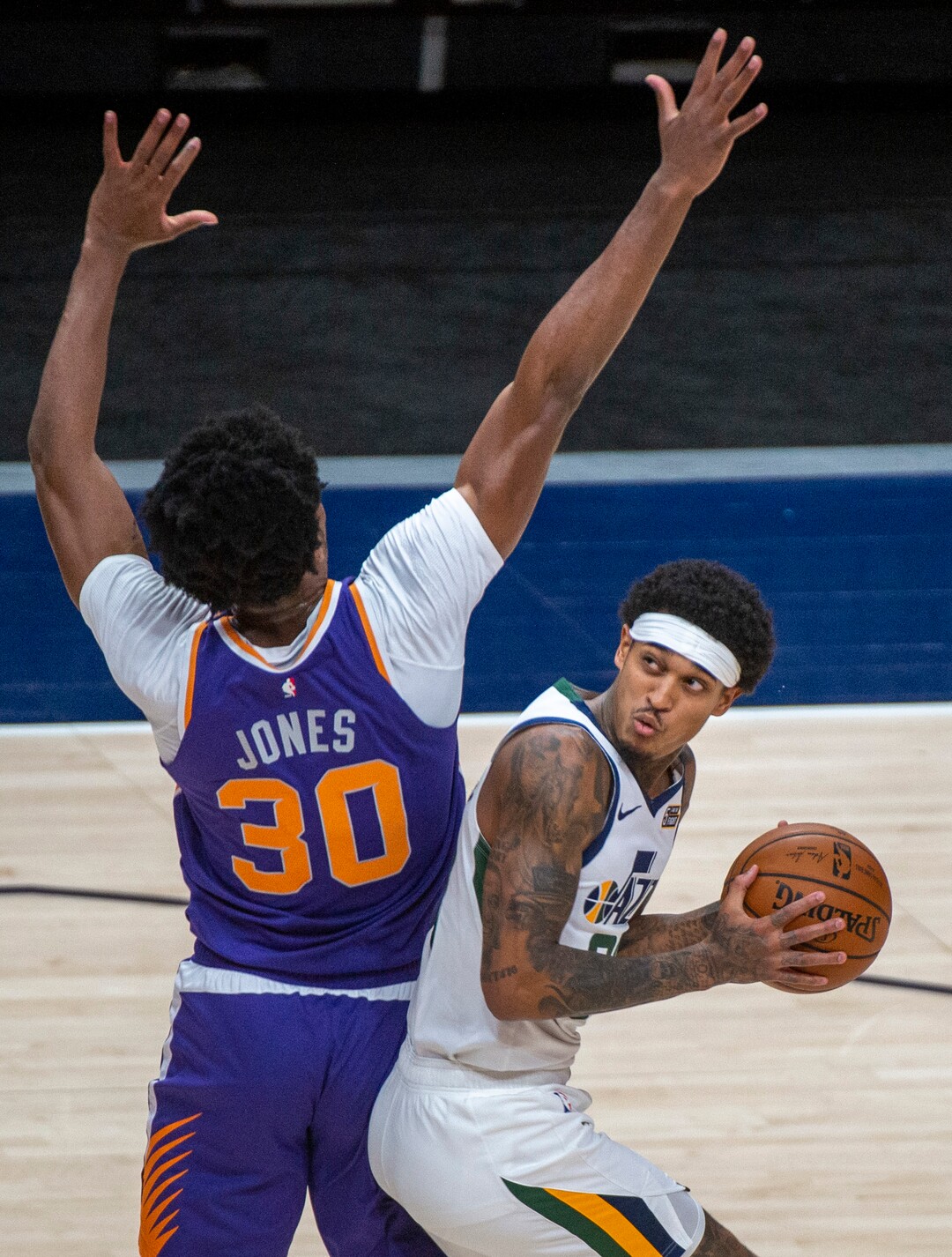 (Rick Egan | The Salt Lake Tribune)  Utah Jazz guard Jordan Clarkson (00) looks for a shot, as Phoenix Suns center Damian Jones (30) defends, in preseason NBA action between Utah Jazz and Phoenix Suns at Vivint SmartHome Area, on Saturday, Dec. 12, 2020.