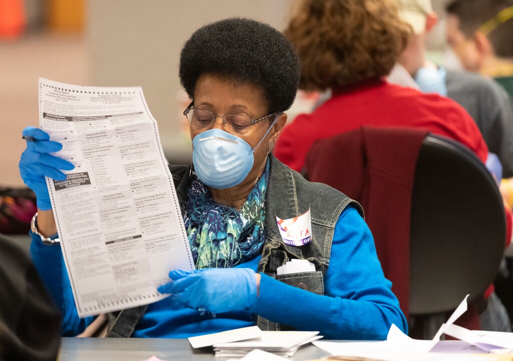 (Mark Hoffman | Milwaukee Journal-Sentinel | AP) City of Milwaukee Election Commission workers process absentee ballots in Wisconsin's presidential primary election, Tuesday, April 7, 2020, in Milwaukee, Wis.