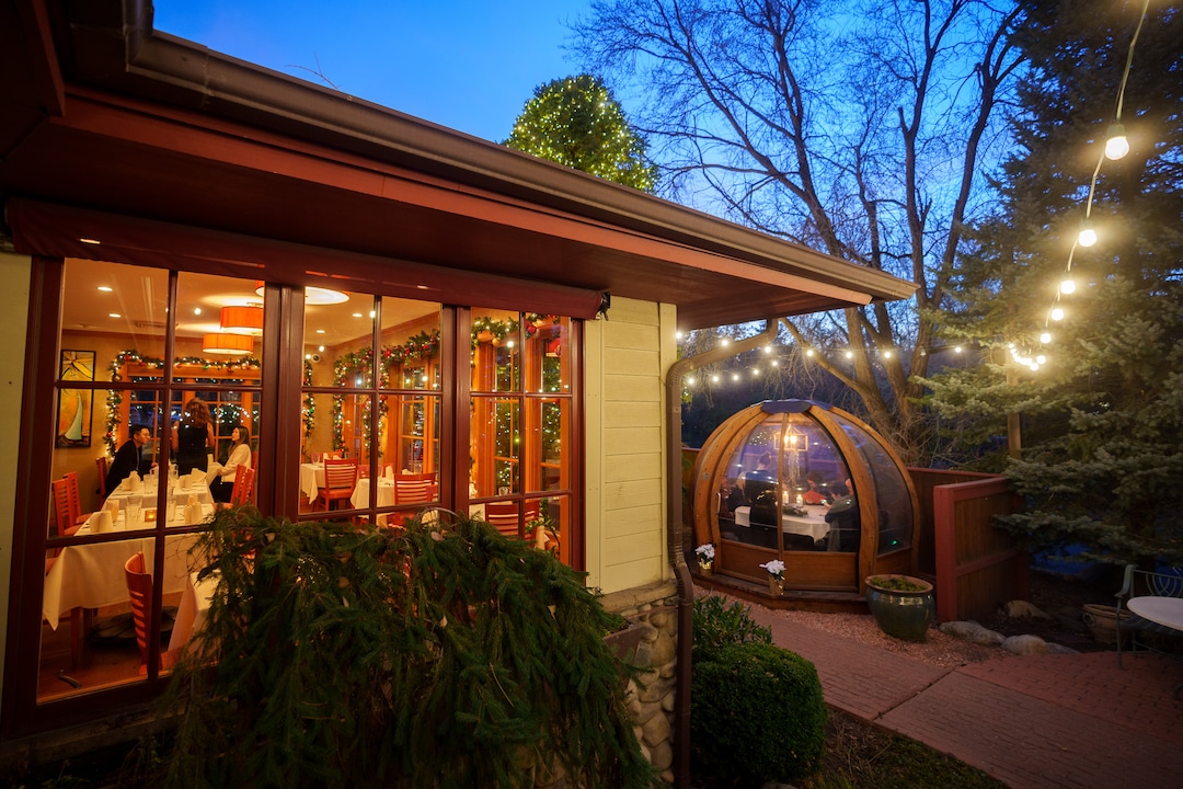 (Trent Nelson  |  The Salt Lake Tribune) Christmas decorations at Franck's Restaurant in Holladay on Saturday, Dec. 4, 2021. Outside the restaurant is an Alpenglobe, a dining shelter.