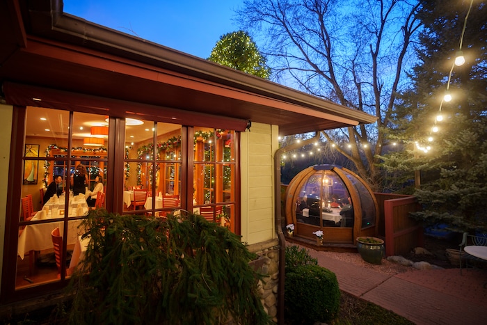 (Trent Nelson | The Salt Lake Tribune) Christmas decorations at Franck's Restaurant in Holladay on Saturday, Dec. 4, 2021. Outside the restaurant is an Alpenglobe, a dining shelter.