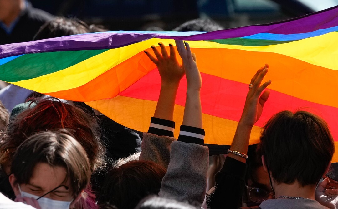 (Francisco Kjolseth | The Salt Lake Tribune) Students at West High School wave a pride flag as they stage a walkout on Wednesday, April 6, 2022 to protest HB11, which bans transgender girls from participating in female school sports.