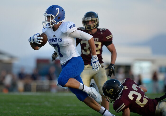 Scott Sommerdorf | The Salt Lake Tribune
Bingham WR Braydon Cosper runs after a catch during first half play. Bingham led Lone Peak 21-9 at the half, Friday, September 2, 2016.