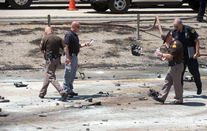 Rick Egan  |  The Salt Lake Tribune

Police sort through the debris from the plane crash that killed four people in the median of I-15 freeway, around 1:00pm. The crash closed the freeway to northbound traffic, Wednesday, July 26, 2017.


