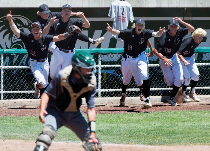 (Rick Egan  |  The Salt Lake Tribune)   Jordan High celebrates their 11-1 win over Olympus, for the 5A state baseball championship, at UVU in Orem, Friday, May 25, 2018.