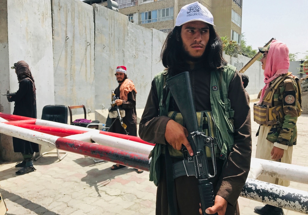 (AP) Taliban fighters stand guard at a checkpoint that was previously manned by American troops near the US embassy, in Kabul, Afghanistan, Tuesday, Aug. 17, 2021.